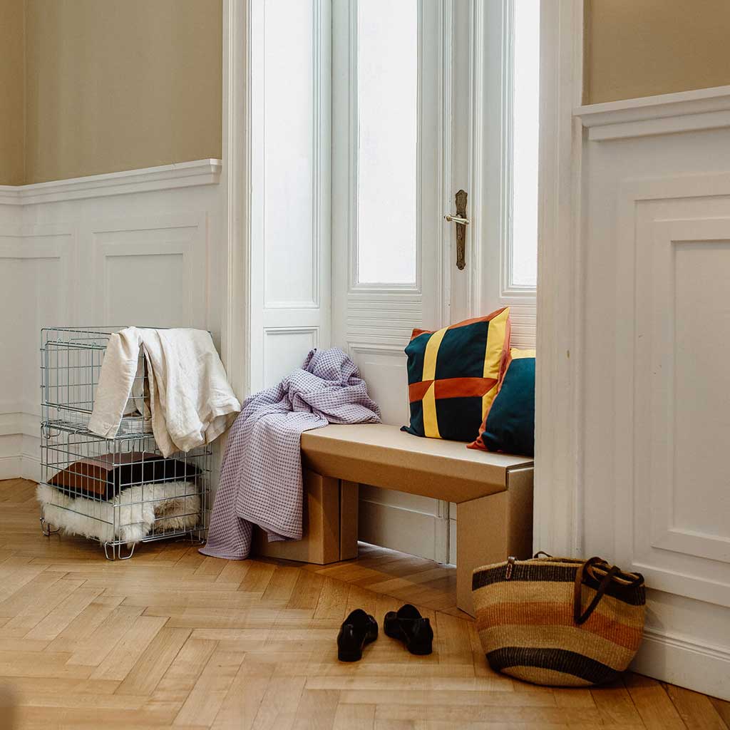 sustainable cardboard bench in hallway